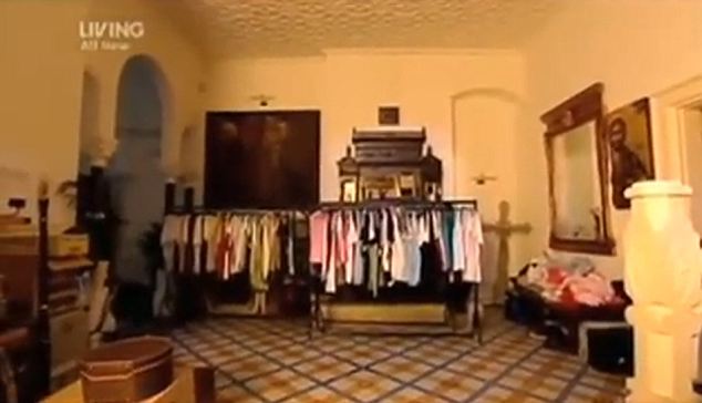 Watching over him: The Icon of Christ was hanging on the right hand side of mirror in George's 'walk-in wardrobe' on the programme filmed in 2008